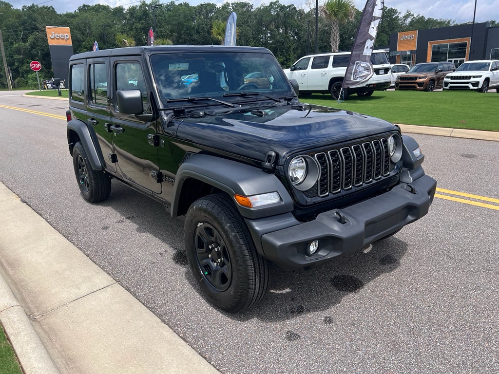 2026 Jeep Wrangler WRANGLER 4-DOOR SPORT in Black Clear-Coat Exterior Paint — front three-quarter view