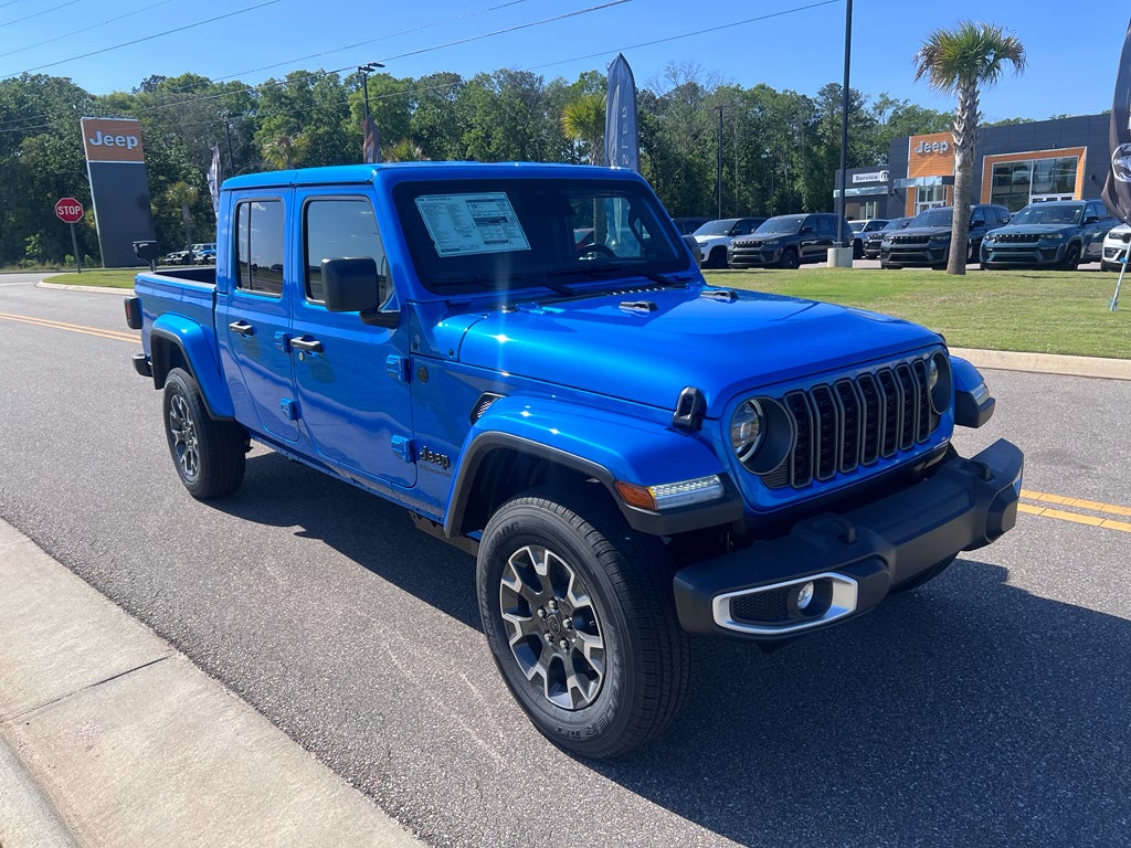 2026 Jeep Gladiator GLADIATOR SAHARA 4X4 in Hydro Blue Pearl-Coat Exterior Paint — front three-quarter view