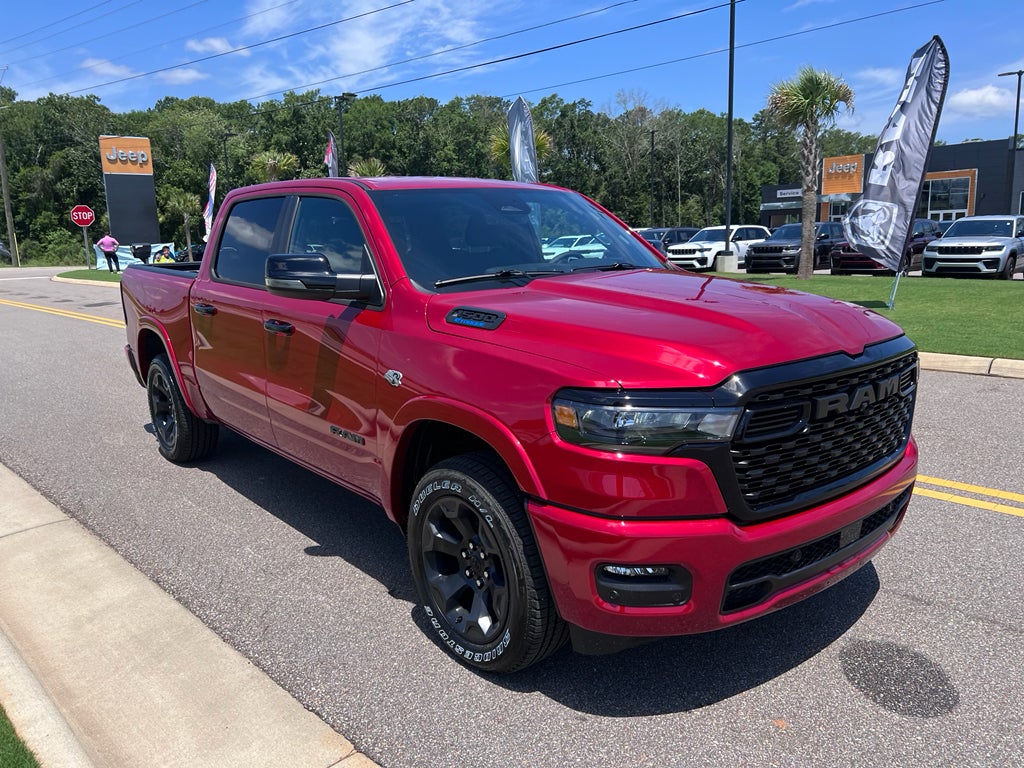 2026 RAM 1500 RAM 1500 BIG HORN CREW CAB 4X4 5'7' BOX in Molten Red Pearl-Coat Exterior Paint — front three-quarter view