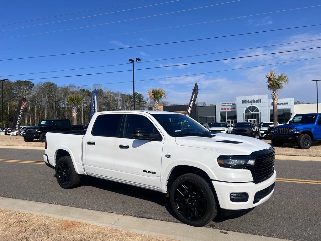 2026 RAM 1500 RAM 1500 LARAMIE CREW CAB 4X4 5'7' BOX in Ivory White Tri-Coat Pearl-Coat Exterior Paint — front three-quarter view