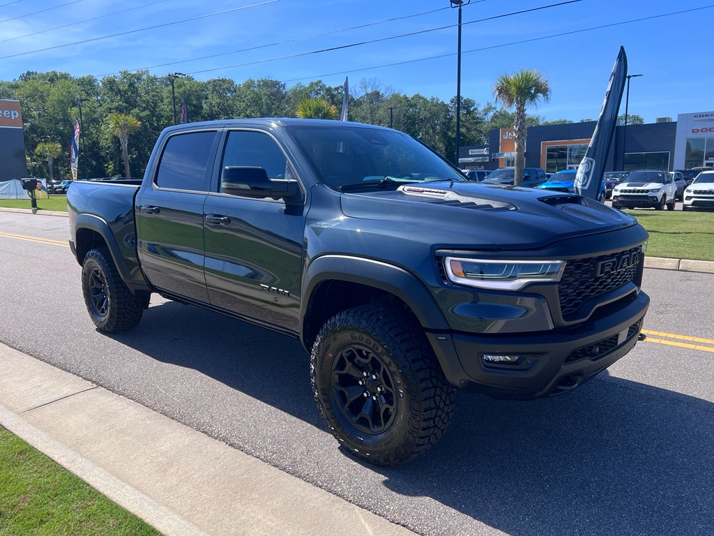 2026 RAM 1500 RAM 1500 RHO CREW CAB 4X4 5'7' BOX in Forged Blue Metallic Exterior Paint — front three-quarter view