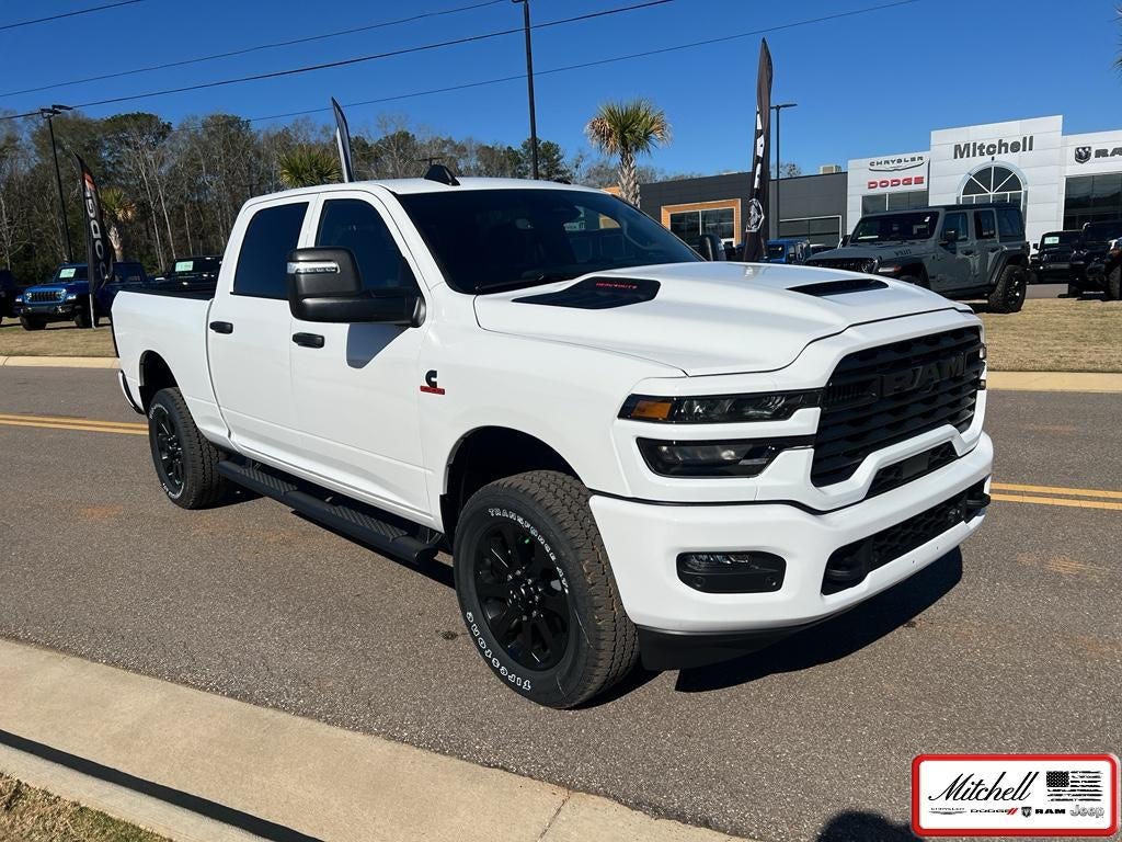 2026 RAM 2500 RAM 2500 BLACK EXPRESS CREW CAB 4X4 6'4' BOX in Bright White Clear-Coat Exterior Paint — front three-quarter view